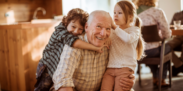 Grandfather playing with two grandkids